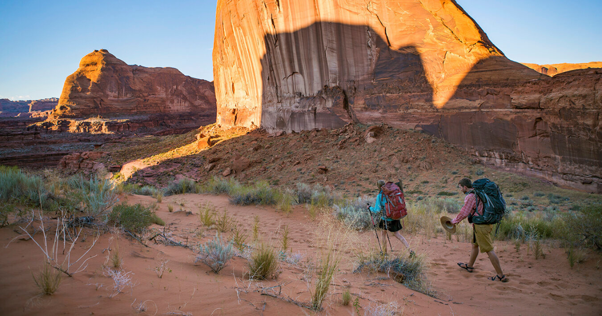 erics friends walking through coyote gulch backpacking and hiking adventures