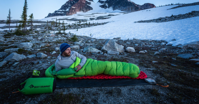 featured image eric in banff on a sleeping mattress using a sea to summit sleeping bag