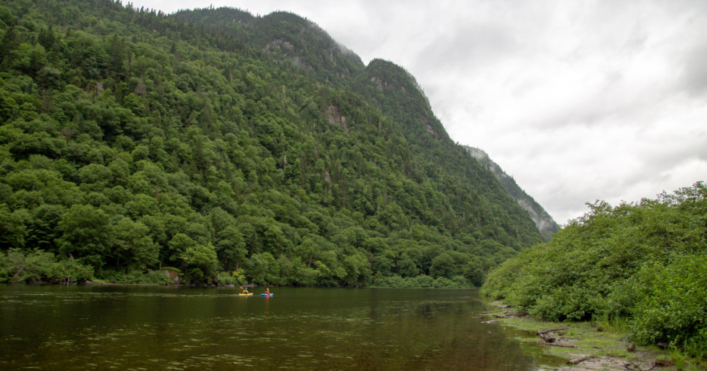 kayakers in Jacques-Cartier National Park in Québec City photography landscape paddle tales paddletv facing waves