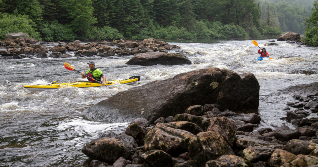 ken whiting and tour guide white water kayaking in Jacques-Cartier National Park in Québec City facing waves paddletv paddle tales