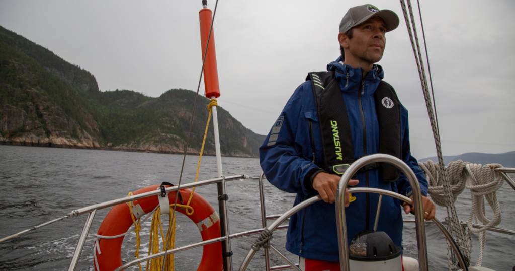 ken whiting sailing in Saguenay-Lac-Saint-Jean, Québec paddletv paddle tales facing waves