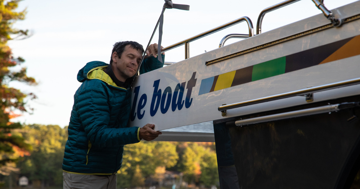 ken whiting hugging le boat in the rideau canal