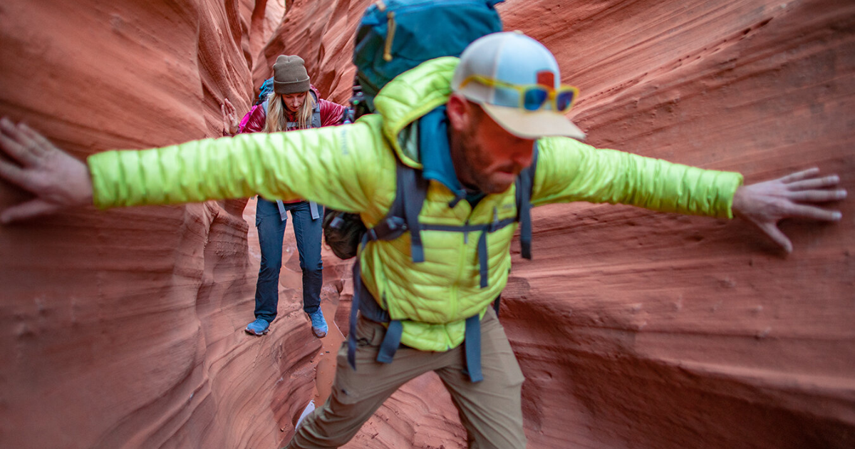 eric going through rocks in utah backpacking and hiking