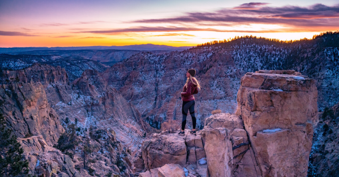 featured image kristi overlooking a moutain landscape backpacking and hiking