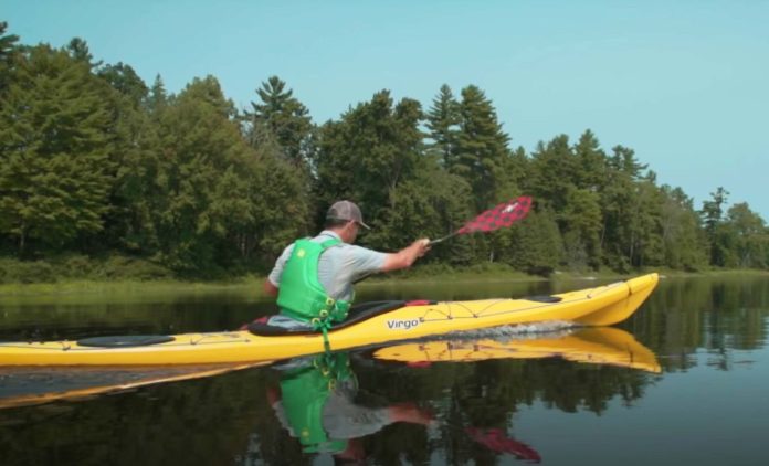 photo of ken whiting using the pandh virgo kayak in yellow on flat water kayaking and paddling gear reviews paddletv and the lendal strom paddle