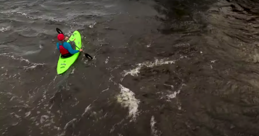 ken whiting paddling a current in a jackson kayak antix gear review