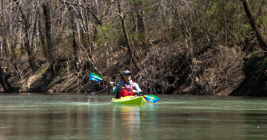ken whiting paddling in a forest using the liquid logic saluda kayak