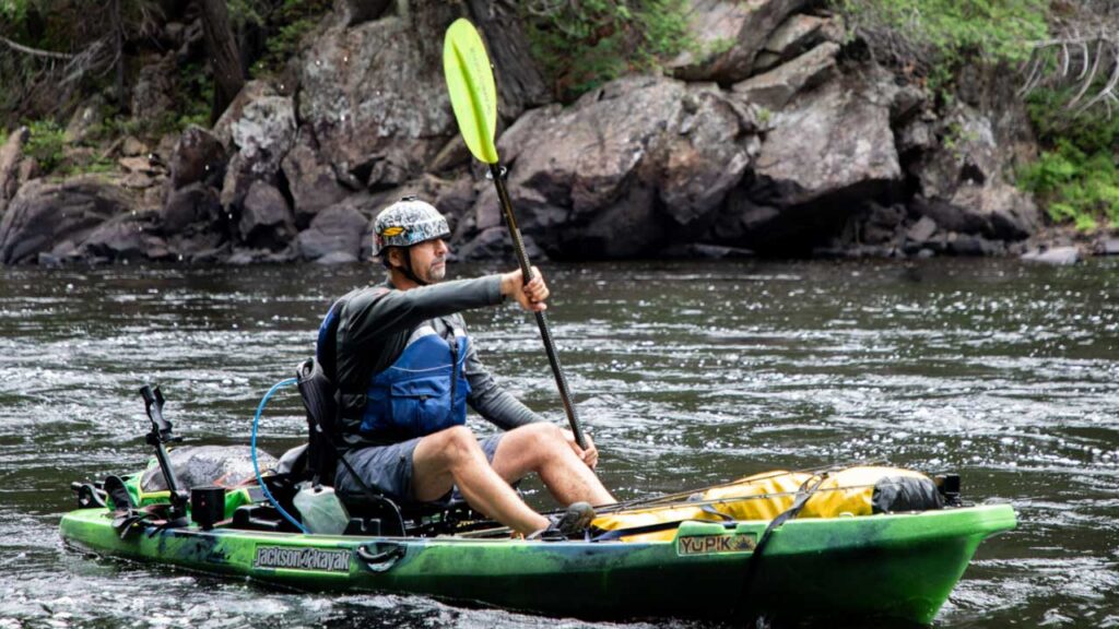 kayak helmets on a kayaker in class 1 and 2 whitewater