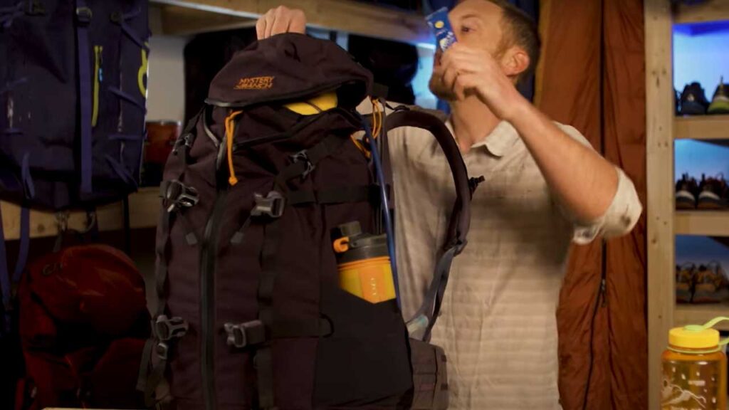 Backpacking packing list tip: putting sunscreen in the top of my backpack for easy access
