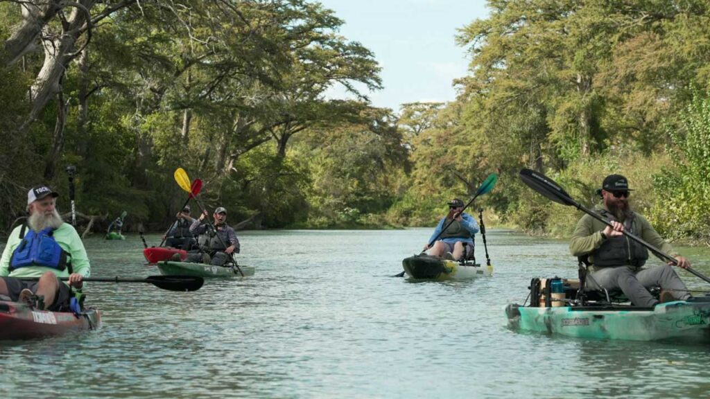 The gang from TG Canoes taking me down the San Marcos River to black bass fishing grounds
