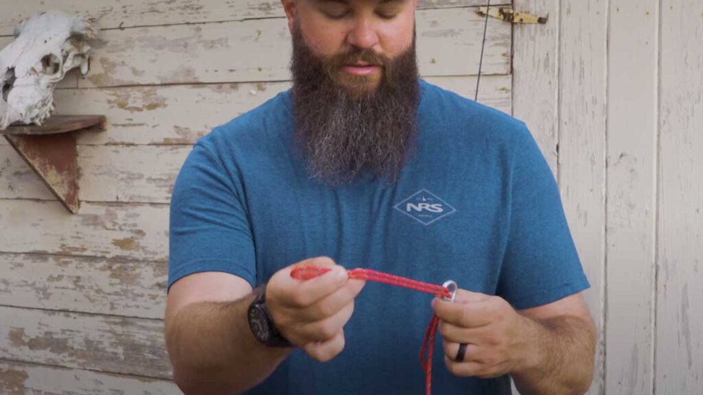 Palomar Knot: 3 - Pull it through the hole with enough of a loop to fit back over the bait or hook