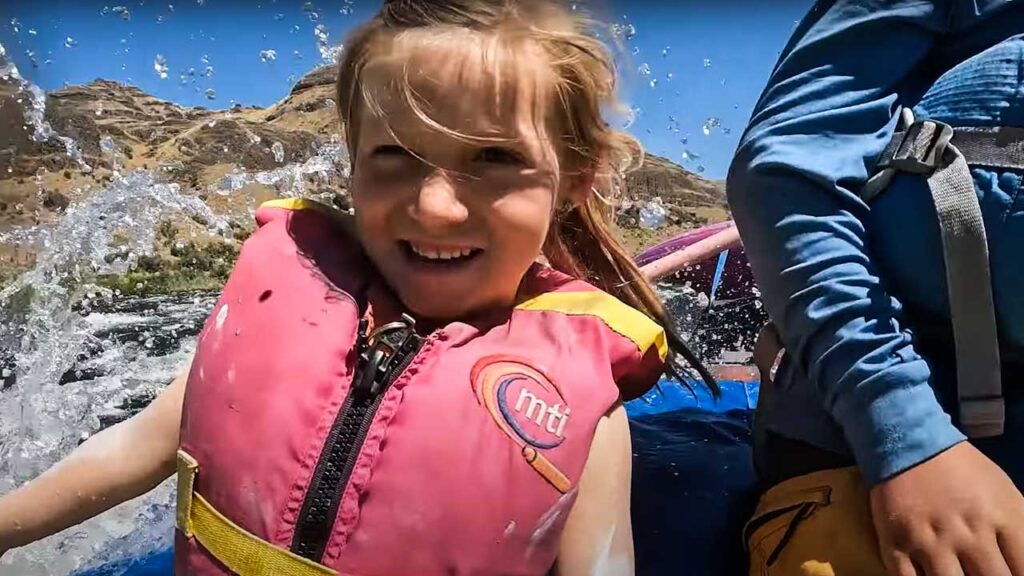 best family adventure vacations: Parker is all smiles as we hit the rapids!