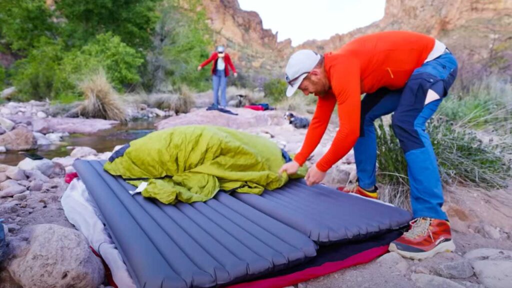 Zenbivy Light Double Camping Bed setup:  Step 1, cover your two sleeping mats with the first layer.