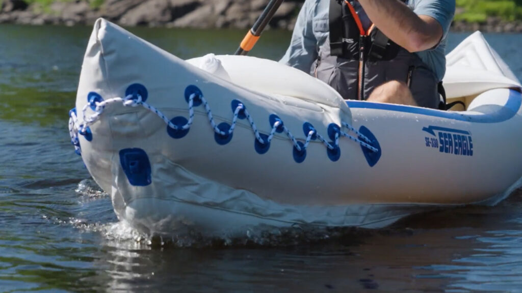Sea Eagle inflatable kayak cutting through water.
