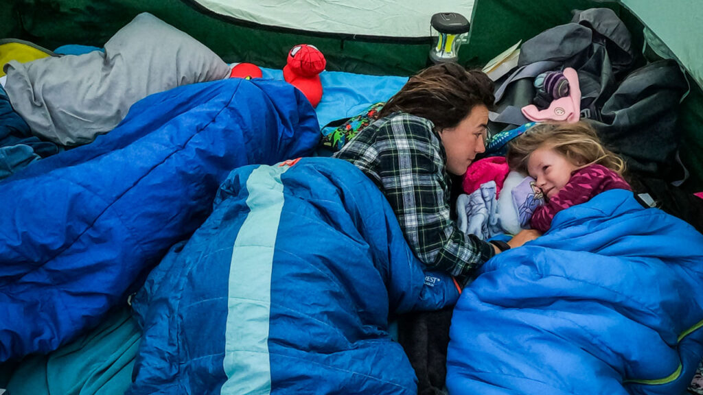 Comfort on a camping trip can be accomplished by bring something familiar from home.  Like a Barbie pillow.