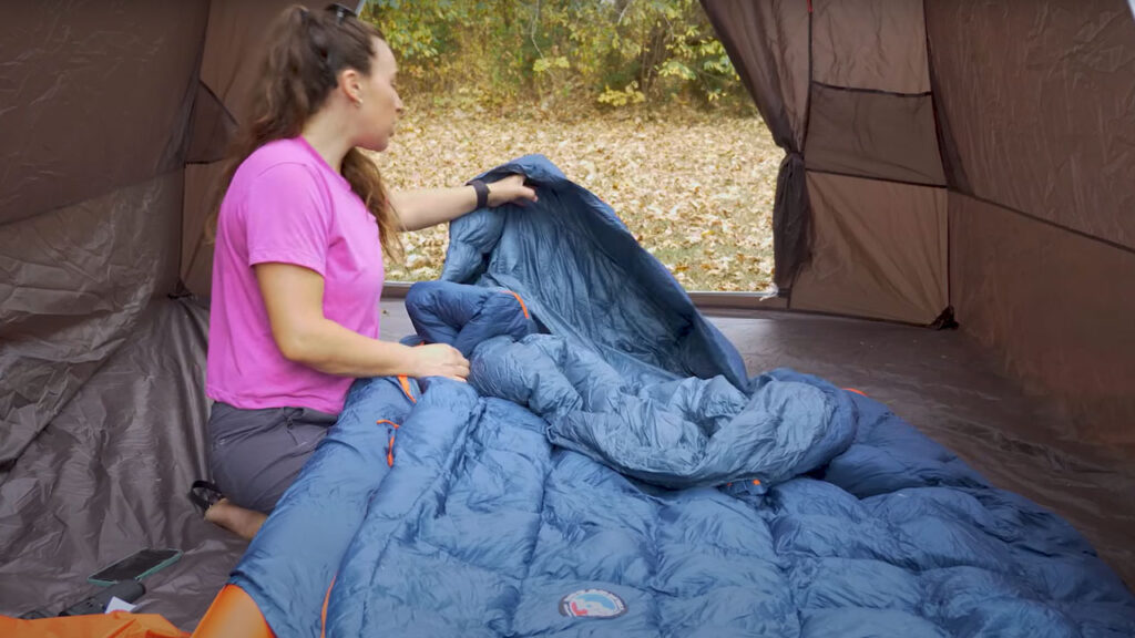 The Zenbivy bed is more like a sleeping bag vs a quilt.  It too has anti-slip systems in place.