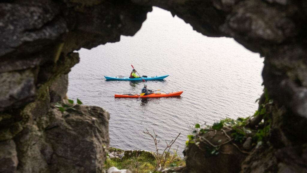 Cool photo of us kayaking from behind an old ruin.