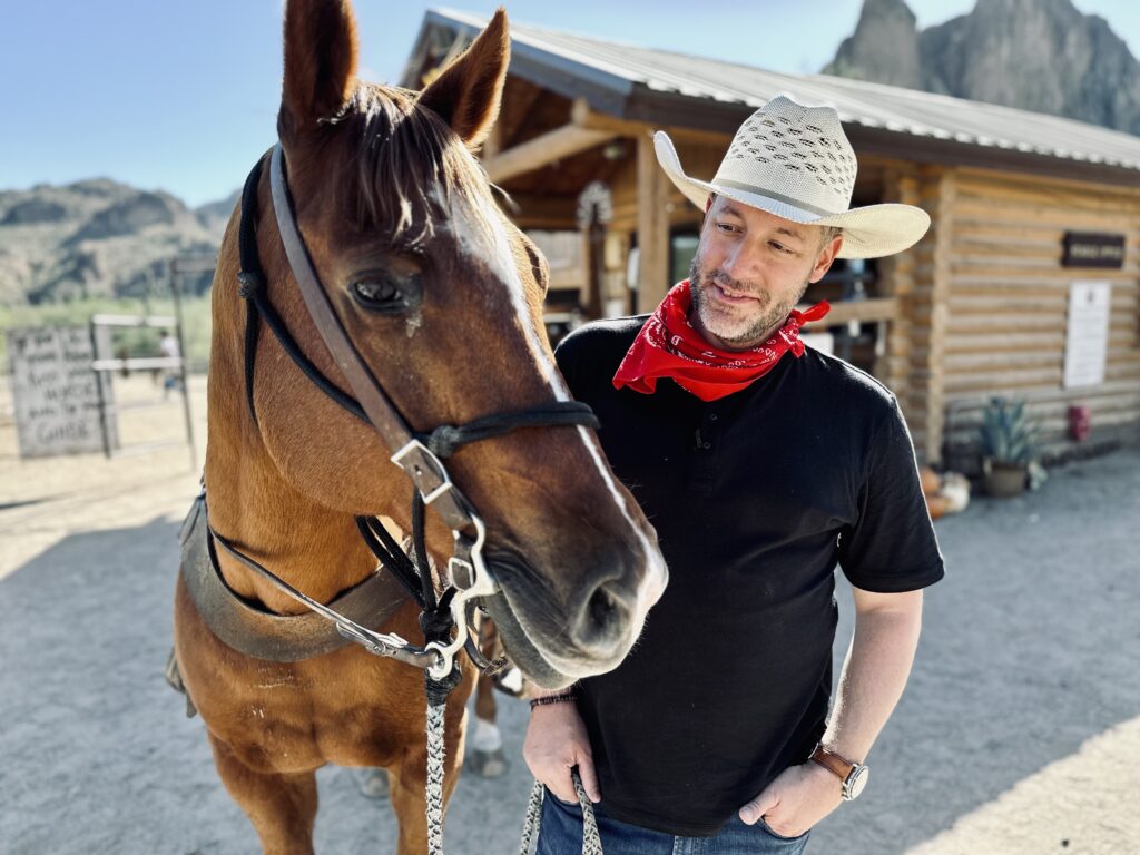 Jonathan Thompson, smiling at a horse, Scottsdale, Arizona