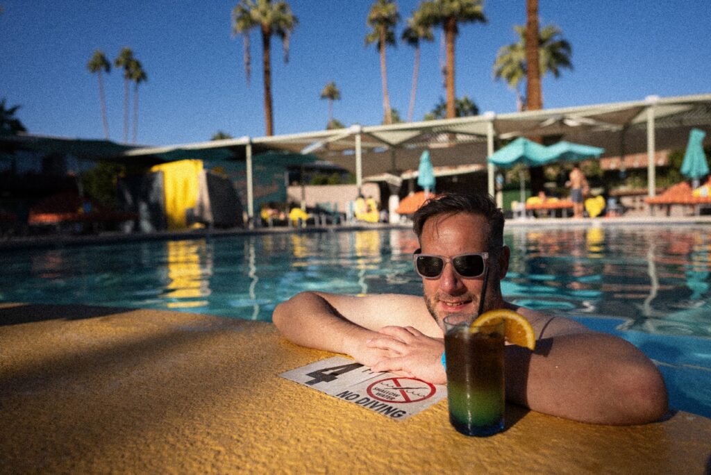 Host Jonathan poolside with a drink at Hotel Valley Ho in Scottsdale, Arizona.