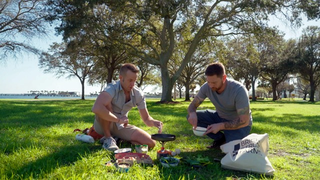 Image of Chef Corso and Chef Reinsmith having a picnic in St. Pete-Clearwater's Vinoy Park.