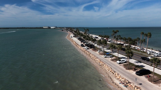 Aerial view of the Dunedin Causeway with blue skies.
