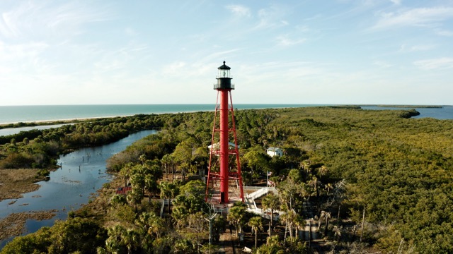 Aerial view of a lighthouse on peninsula.