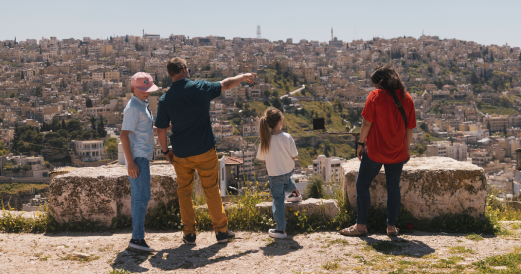 emily jackson, nick troutman, and family overlooking the modern oasis of amman jordan