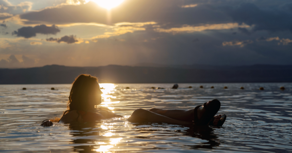 emily jackson floating in the dead sea in aqaba jordan on an adventure