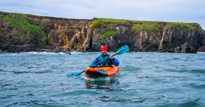 ken whiting kayaking in northern california with an aqua bound paddling and a pyranha kayak