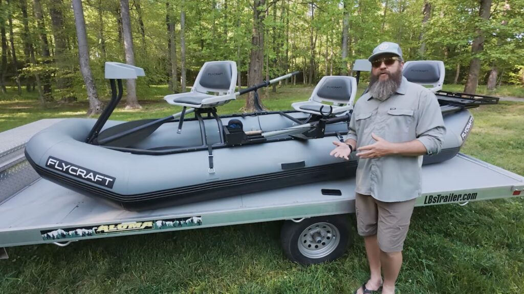 Flycraft Guide 3, Jameson standing in front of inflatable boat