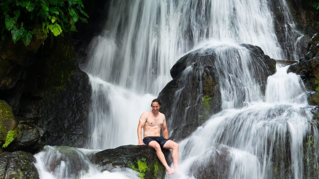 Travel Accident Insurance provided by Redpoint Travel Protection, Mike sitting in a
waterfall