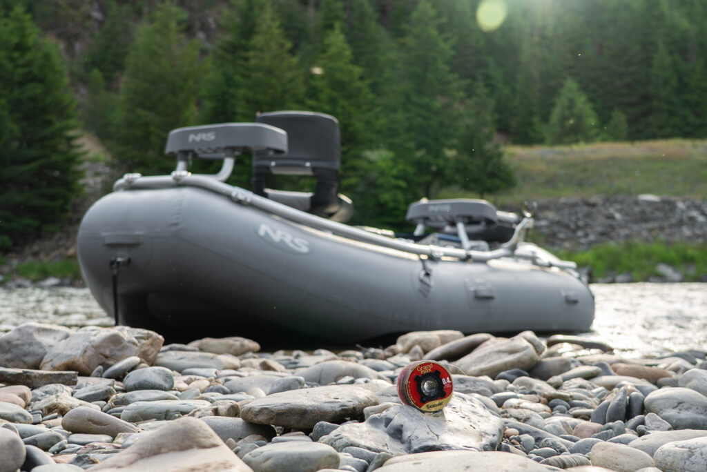 3 person fishing raft on shore