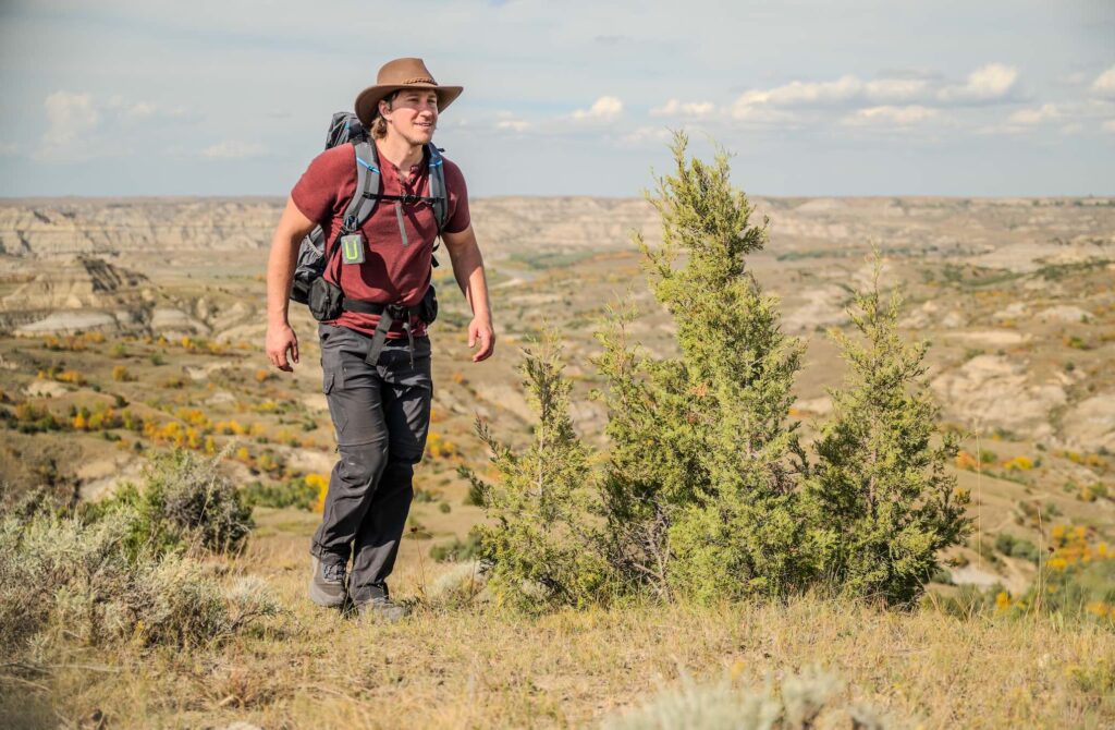 Photo of man hiking on the Maah Daah Hey Trail in North Dakota