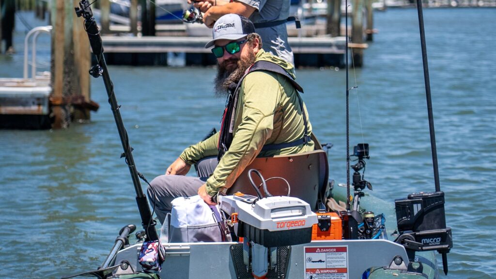 Man sitting on the Sea Eagle FishSkiff 16 inflatable fishing boat